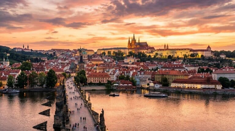 A stunning sunset over Prague, Czech Republic, featuring Prague Castle and the bustling Charles Bridge.