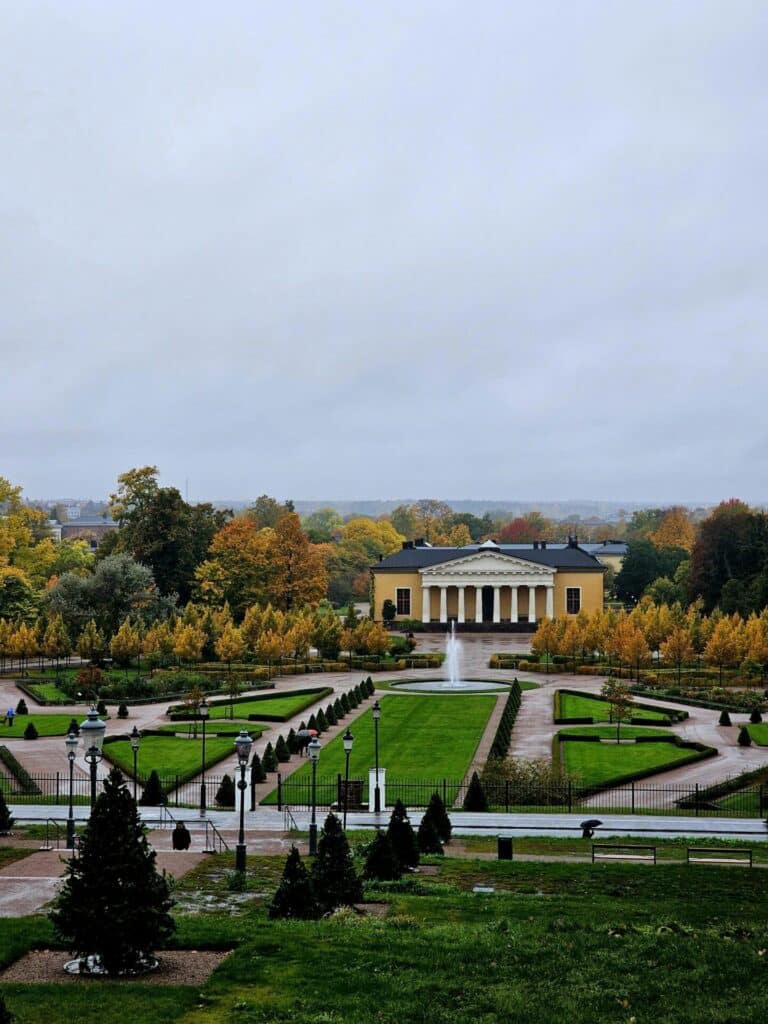 The Linneanum building in the Botanical Garden of Uppsala, Sweden, viewed from above on a rainy autumn day.
