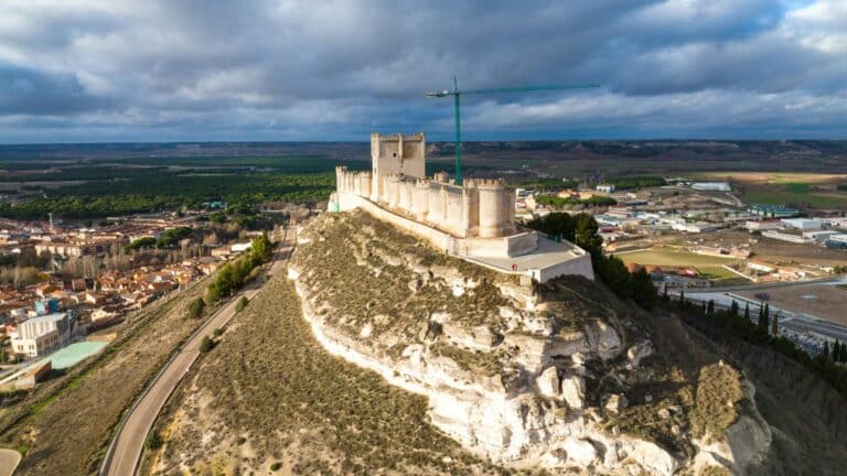 An aerial view of the medieval Peñafiel Castle situated on a large hill overlooking the town in Valladolid.
