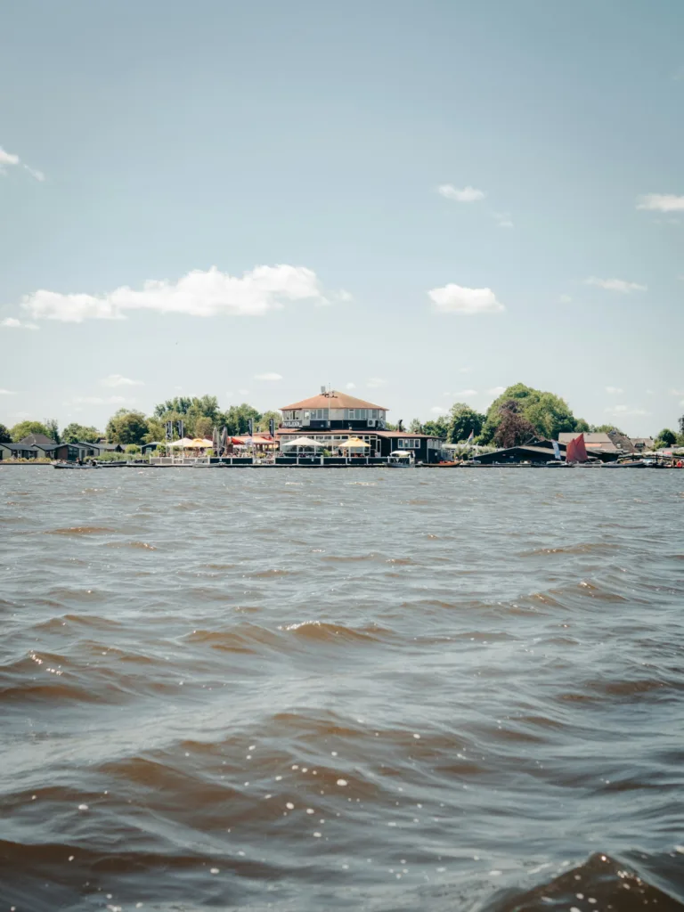 citygame Giethoorn brown and white building near water