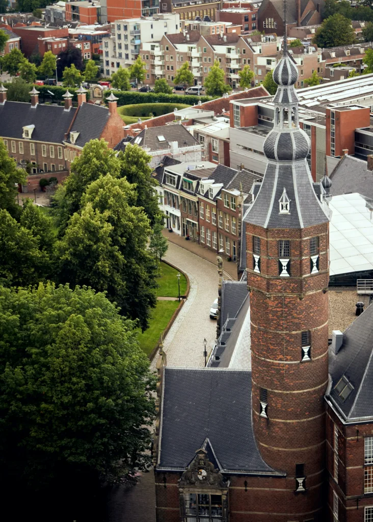 City Game  Groningen a stunning aerial view of Groningen, featuring historic architecture, lush green spaces, and the iconic tower of the Prinsenhof.
