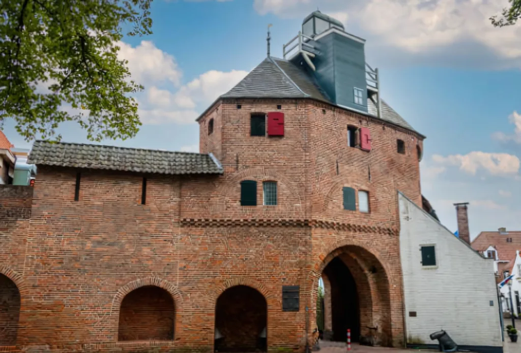 City Game Harderwijk the old medieval city wall in the city of Harderwijk with the only remaining gate in the wall called 'the Vischpoort