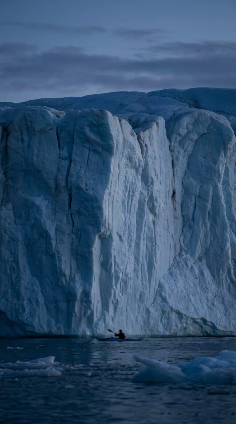 Kayaking at the Base of a Greenland Glacier