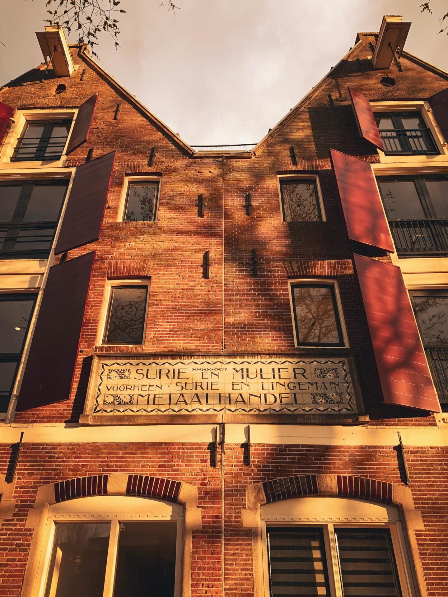 Historic Twin-Gabled Brick Building in Amsterdam