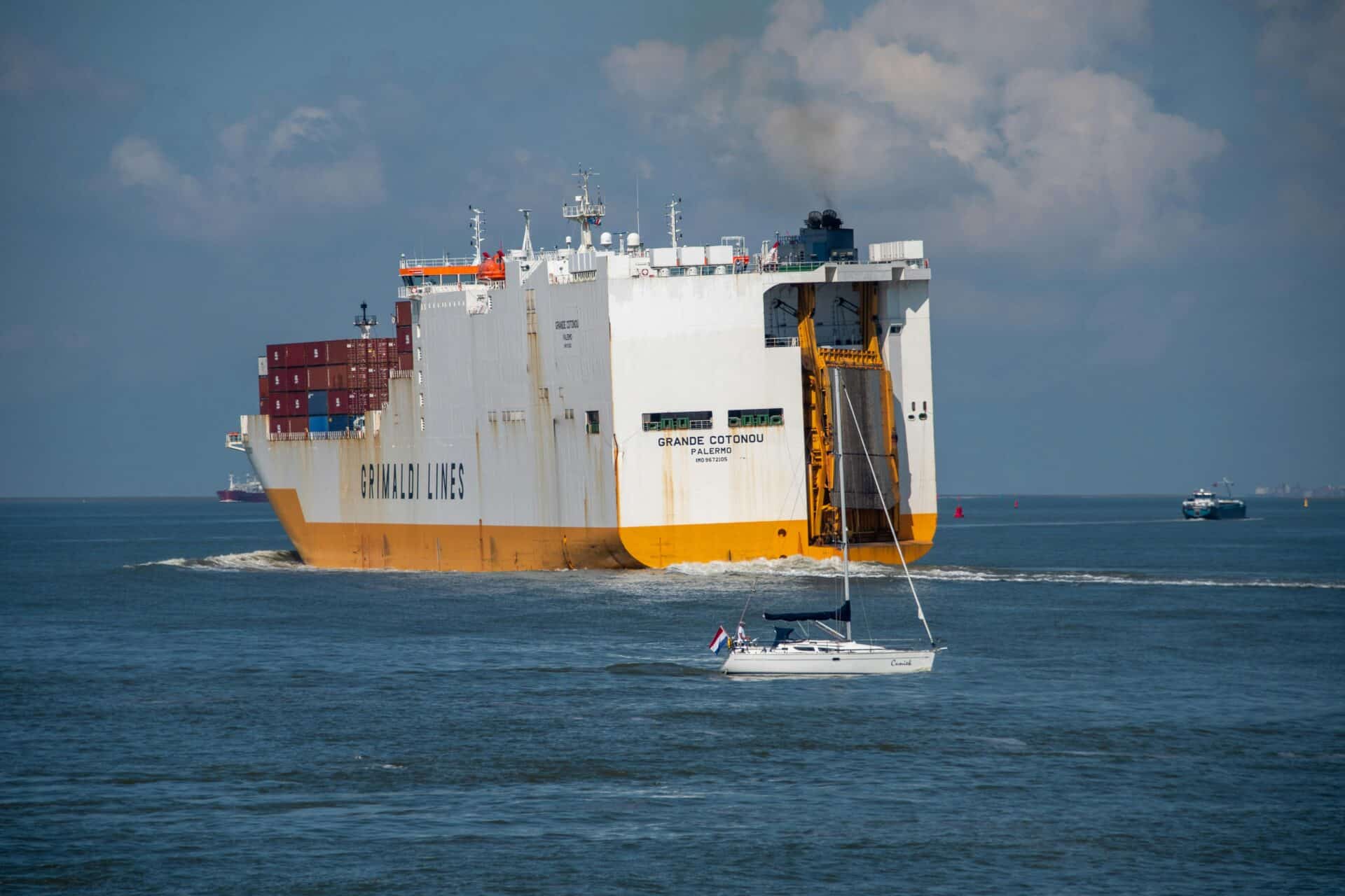 Cargo Ship and Sailboat Near Terneuzen